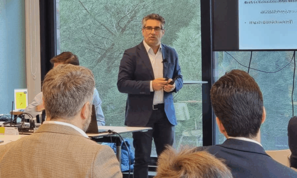 A researcher in a suit presents a new DPI project to the participants of the DPI Autumn Meeting 2025