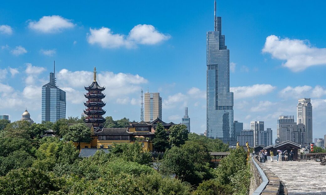 The skyline of Nanjing shows hypermodern buildings next to traditional looking ones.
