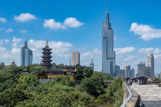 The skyline of Nanjing shows hypermodern buildings next to traditional looking ones.